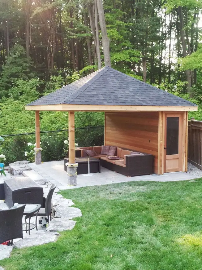 Custom pool cabana beside a backyard pool