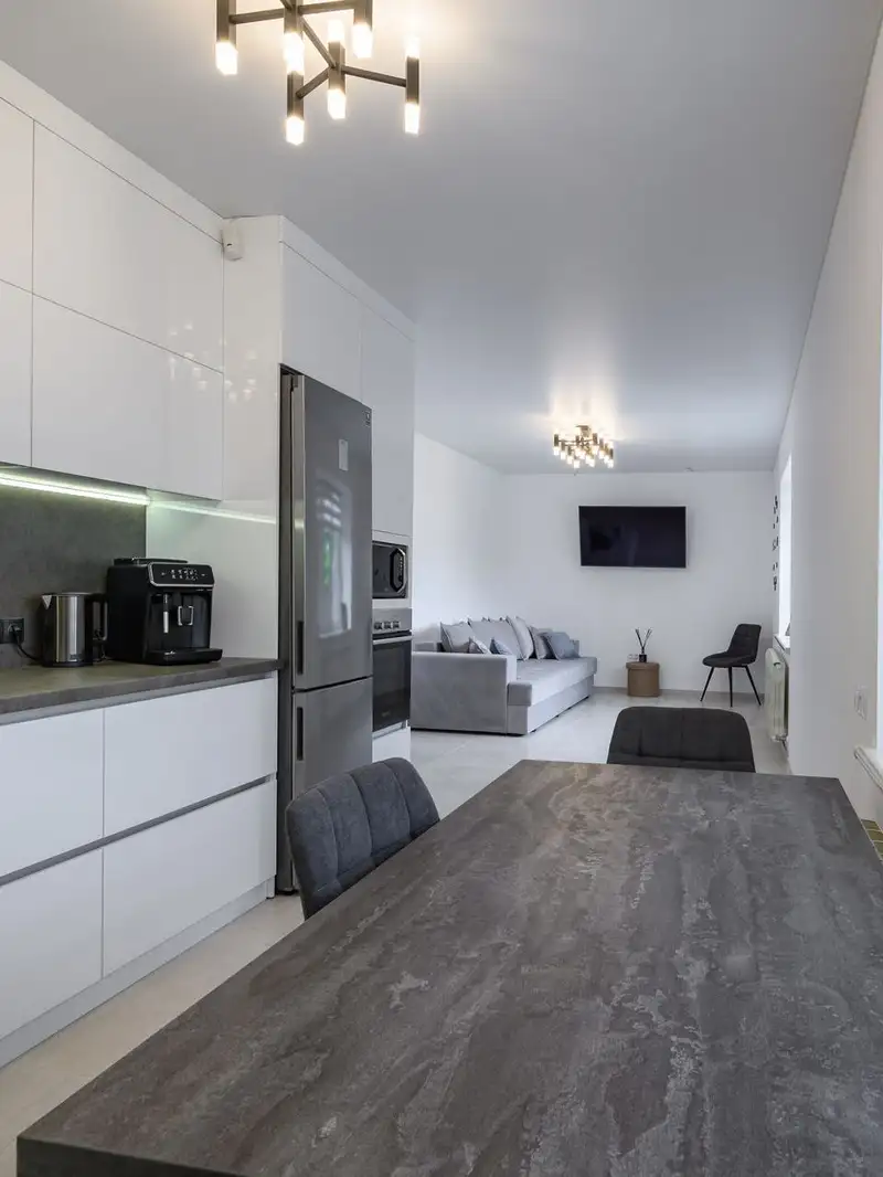 Modern open concept kitchen with granite counter top